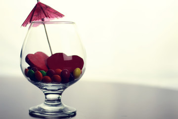 glass with candy pill