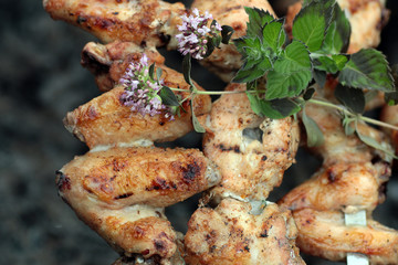 Chicken on the grill to cook
