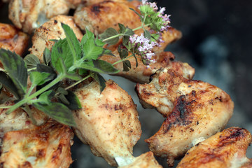 Chicken on the grill to cook