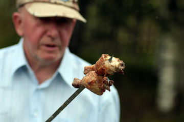 Chicken on the grill to cook