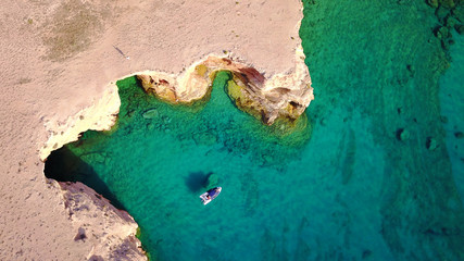 Aerial drone photo of famous caves of Ksylobatis near Pori beach, Koufonissi island. Cyclades, Greece