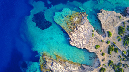 Fototapeta na wymiar Aerial drone photo of famous caves near Pori beach, Koufonissi island. Cyclades, Greece