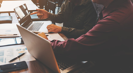 Business concept. Business people discussing the charts and graphs showing the results of their successful teamwork.