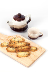 Home made a small sweet cookie with black sesame, typically round, flat, and crisp.Cookie on white.
