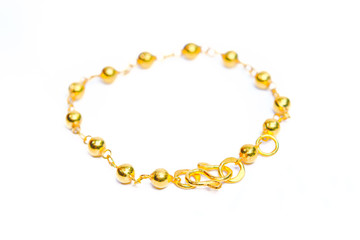 Gold bracelet isolated on white