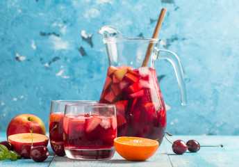 Refreshing sangria or punch with fruit - obrazy, fototapety, plakaty
