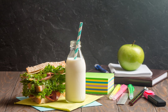 School lunch with sandwich, milk and apple 