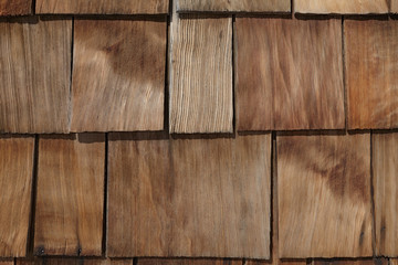 Natural unpainted old house branchy wood wallboard pattern background.