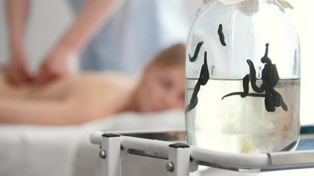 Hirudotherapy - leeches in clinic, in front of massage
