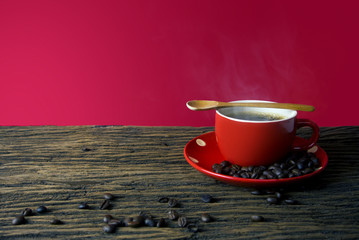 red hot coffee cup with wood spoon