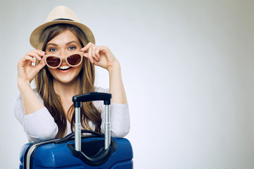 Smiling woman wearing sun glasses and hat