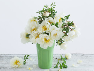 white roses in vase
