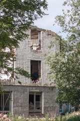 The old destroyed brick multi-storey building