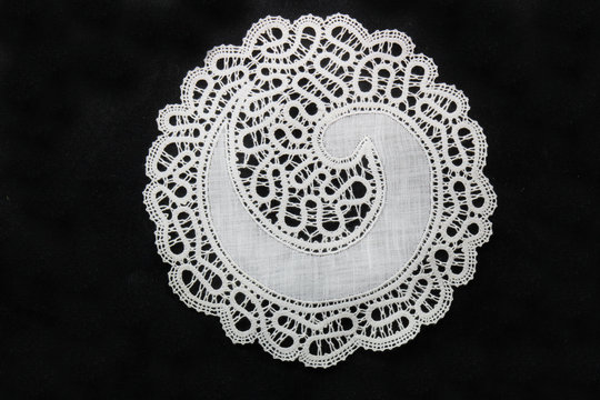 traditional lace from idrija in slovenia on black background with copy space motif pattern with copy space