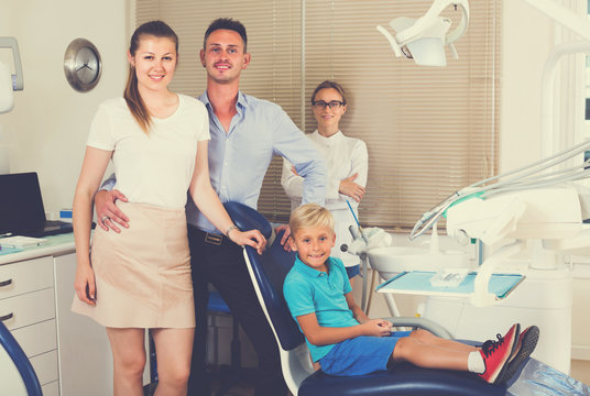 Family of three is on dentist's receptionist