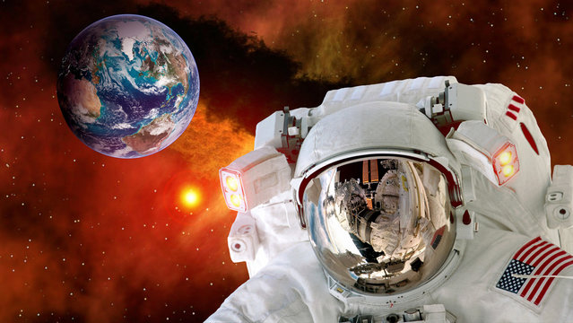 Astronaut planet Earth spaceman helmet stars space suit galaxy universe. Elements of this image furnished by NASA.