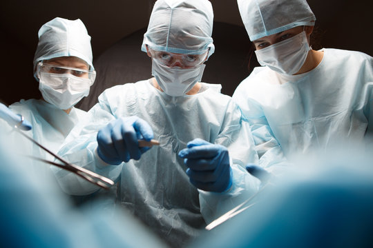 Photo of surgeons with instruments