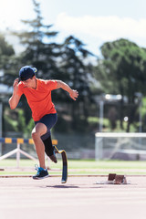 Disabled man athlete training with leg prosthesis.