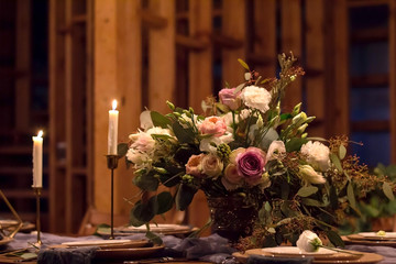Decoration wedding table before banquet in awooden barn.