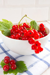 Juicy ripe red currant berries in a bowl of ingredients for a vegetarian vitamin dietary dessert