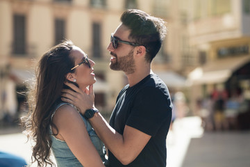 Young man touching his girlfriend tenderly