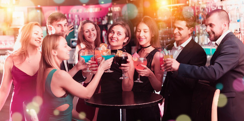 Young employees dancing on corporate party