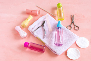 Accessories for manicure or pedicure concept of nail hand and foot care copy space for text or inscription Yellow Pink and red nail Lacquer