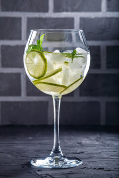 Cocktail with lime and mint. Concept of drinks and alcohol.