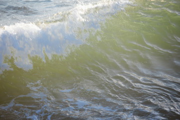 Natural blurred sunny sandy shore outdoors seascape. Coastline abstract background