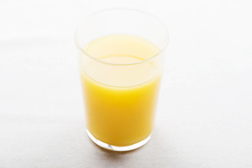 Top view of glass of orange juice.