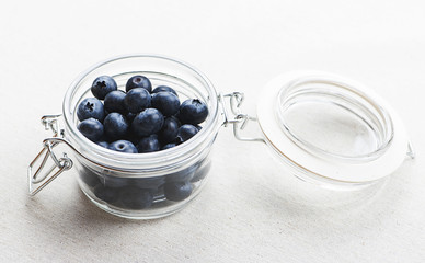 Top view of glass bowl with blueberries.