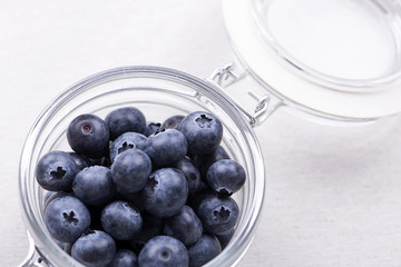 Close-up of glass bowl with blueberries.