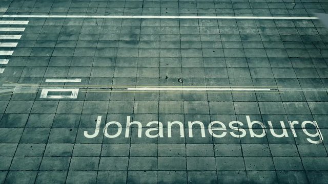 Aerial view of big airplane arriving to Johannesburg airport. Travel to South Africa conceptual intro animation