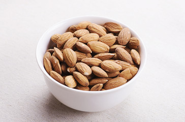 Porcelain container with almonds.
