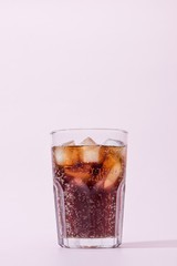 Cola and ice cubes in a glass