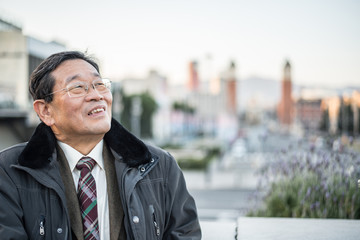 Japanese senior old man outdoors smiling and happy portrait