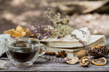 cup of tea with autumn leaves