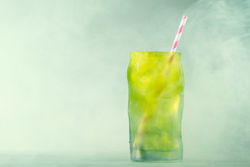 Cold drink in a green glass