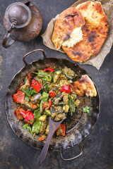 Indian Vegetable Curry Fry with Pita Bread as close-up in a in a frying pan