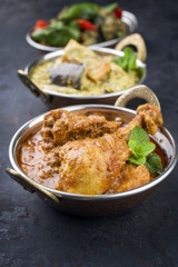 Traditional Indian Curries with Chicken and Vegetable as close-up Korai