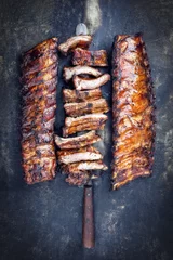 Tuinposter Barbecue Pork Spare Ribs as top view on an old rusty metal sheet © HLPhoto