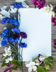 The Cornflowers and Jasmine flowers on wooden background