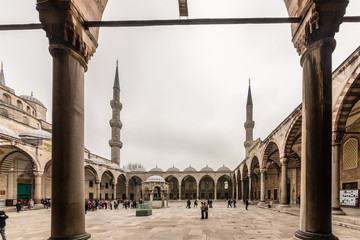 Fototapeta premium View from the outside,inner courtyard and archway of blue Mosque also called Sultan Ahmed Mosque or Sultan Ahmet Mosque in Istanbul, Turkey