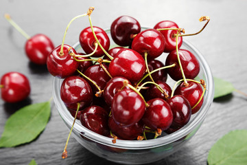 sweet cherries on a black