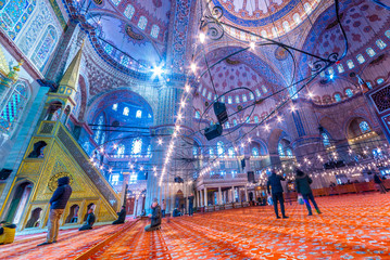 People pray in Blue Mosque also called Sultan Ahmed Mosque or Sultan Ahmet Mosque in Istanbul,...