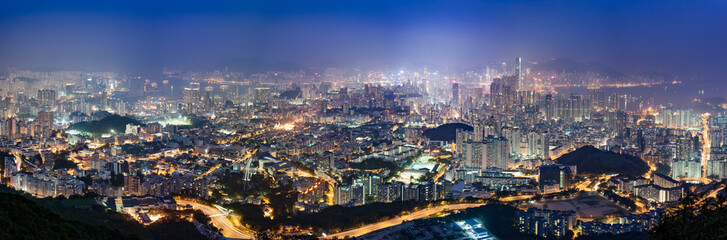 Fototapeta na wymiar Panoramic hazy night view of Kowloon