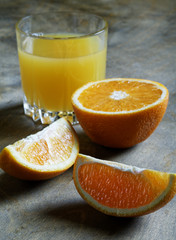 sliced oranges and glass of juice on the table