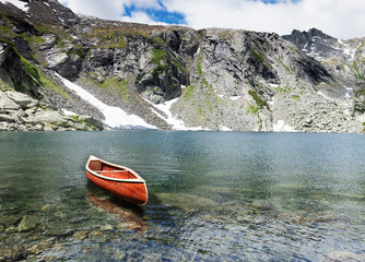 Wooden canoe in the middle of the water © alexandre zveiger