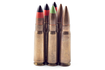 A selection of 7.62 bullets for kalashnikov, isolated on white. Bullets of different types: tracer, armor piercing...