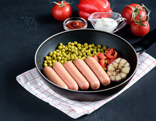 Pan with sausages and vegetables Tasty dinner Place for text